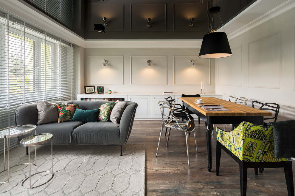 This is an example of a large contemporary open concept living room in Los Angeles with multi-coloured walls, painted wood floors and multi-coloured floor.