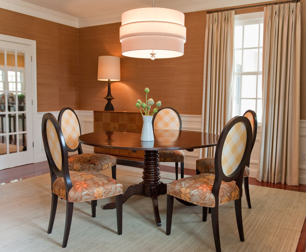 Design ideas for a transitional separate dining room in Boston with brown walls and medium hardwood floors.