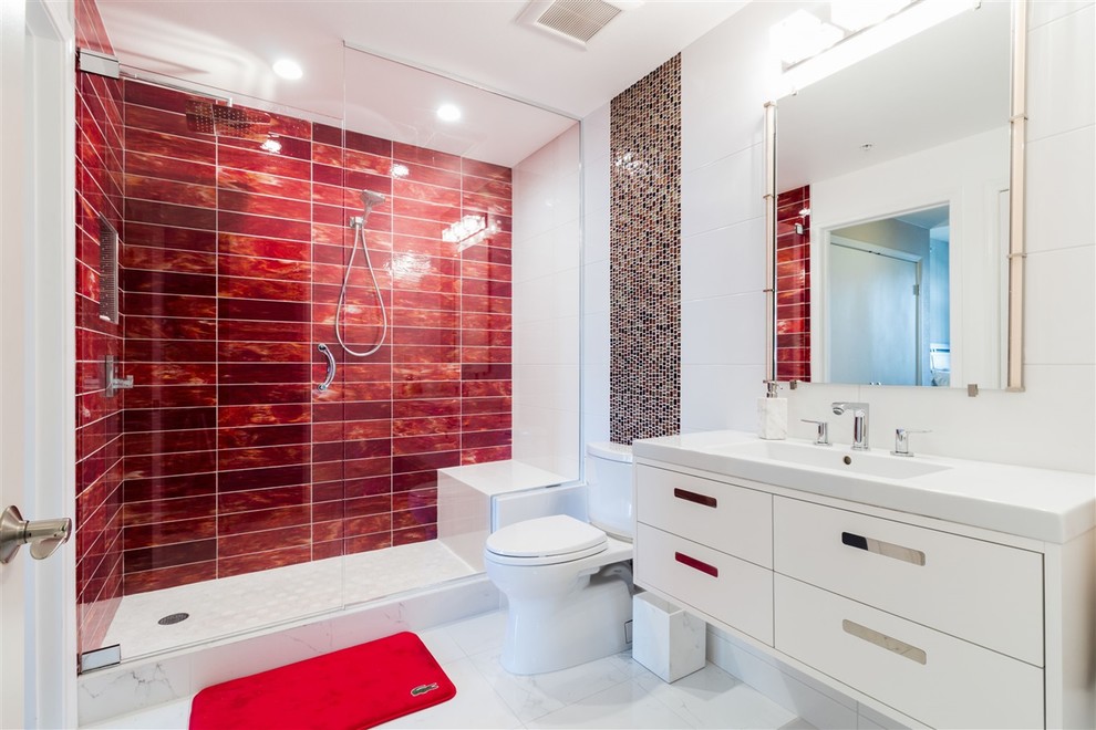 Photo of a mid-sized modern master bathroom in San Diego with flat-panel cabinets, white cabinets, an alcove shower, a two-piece toilet, white tile, porcelain tile, white walls, porcelain floors, an undermount sink, engineered quartz benchtops, white floor, a hinged shower door and white benchtops.