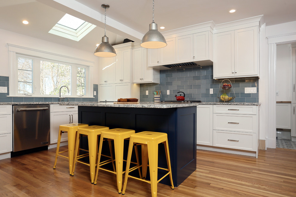Design ideas for a mid-sized transitional l-shaped eat-in kitchen in Boston with an undermount sink, shaker cabinets, white cabinets, quartz benchtops, blue splashback, porcelain splashback, stainless steel appliances, medium hardwood floors, with island and multi-coloured benchtop.