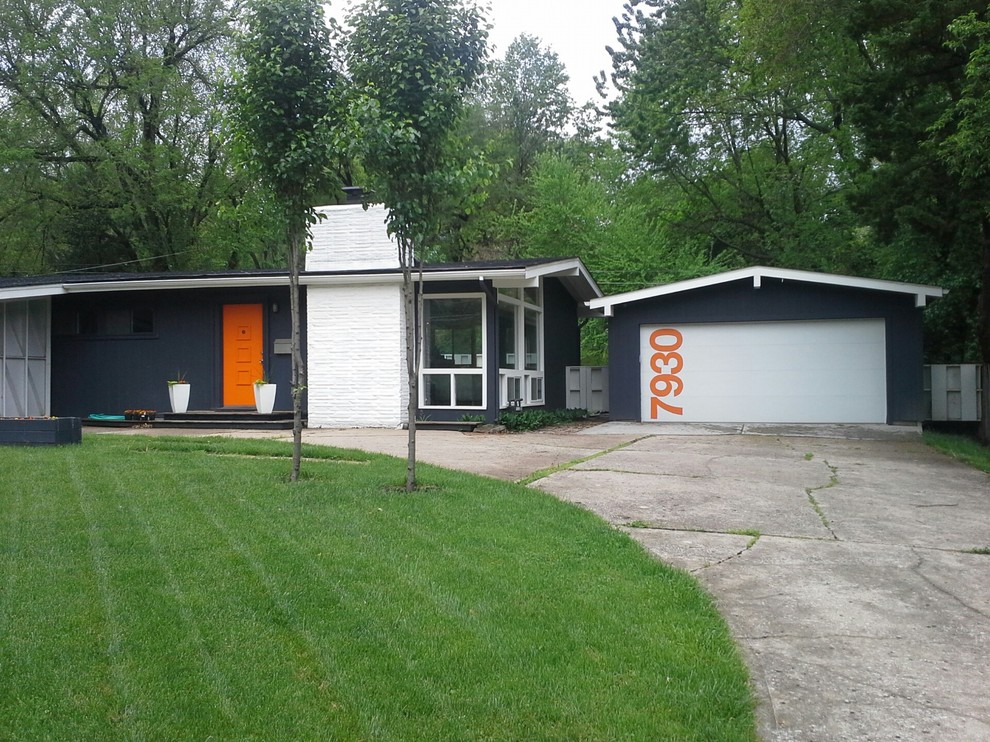 Inspiration for a large midcentury detached two-car garage in Kansas City.