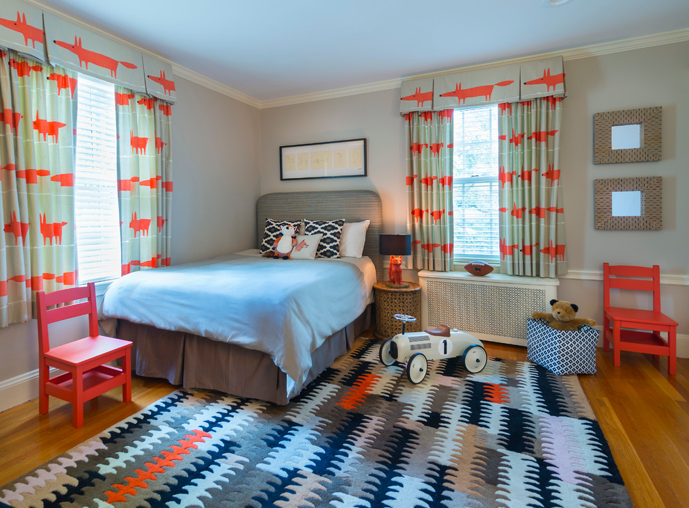 This is an example of a small contemporary gender-neutral kids' bedroom in Providence with grey walls.