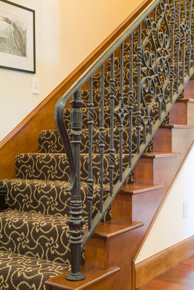 Mid-sized traditional carpeted straight staircase in Oklahoma City with carpet risers and metal railing.