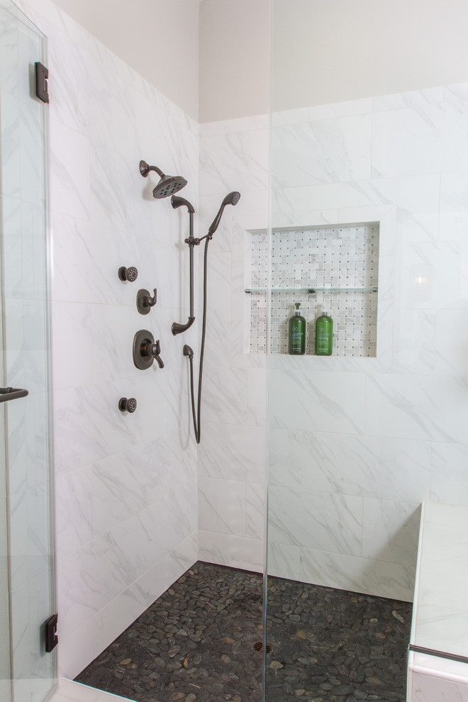 Inspiration for a large industrial master bathroom in Santa Barbara with flat-panel cabinets, medium wood cabinets, a drop-in tub, a corner shower, a two-piece toilet, white tile, porcelain tile, grey walls, porcelain floors, a trough sink and concrete benchtops.