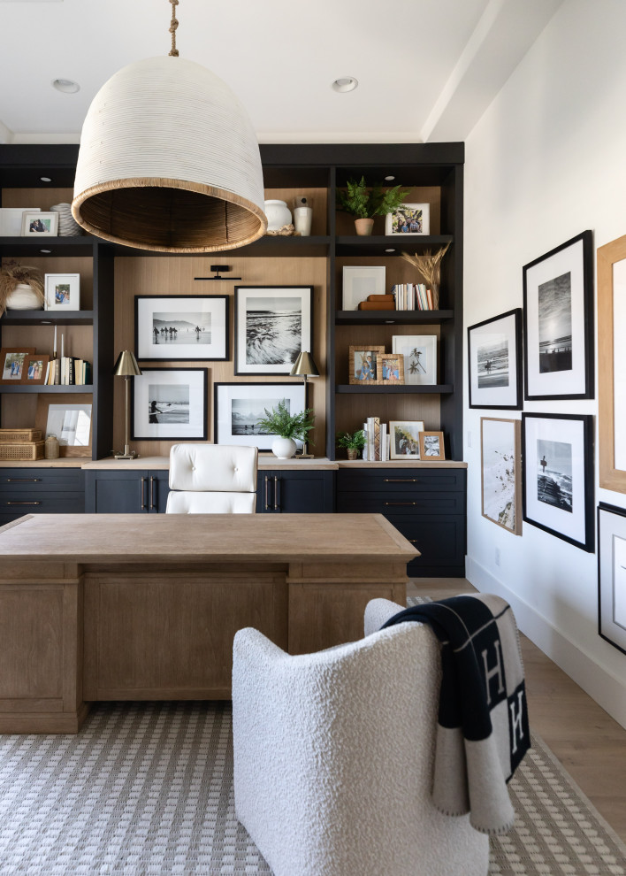 Inspiration for a mid-sized coastal built-in desk coffered ceiling study room remodel in Phoenix with white walls