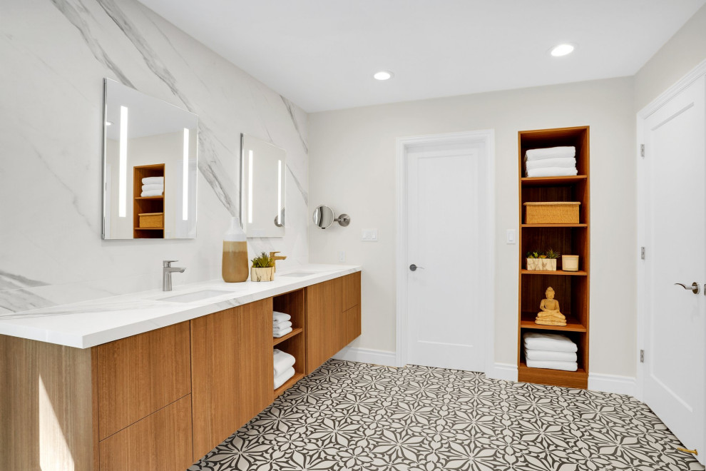 Идея дизайна: ванная комната в современном стиле с плоскими фасадами, фасадами цвета дерева среднего тона, белыми стенами, врезной раковиной, разноцветным полом, белой столешницей, тумбой под две раковины и подвесной тумбой