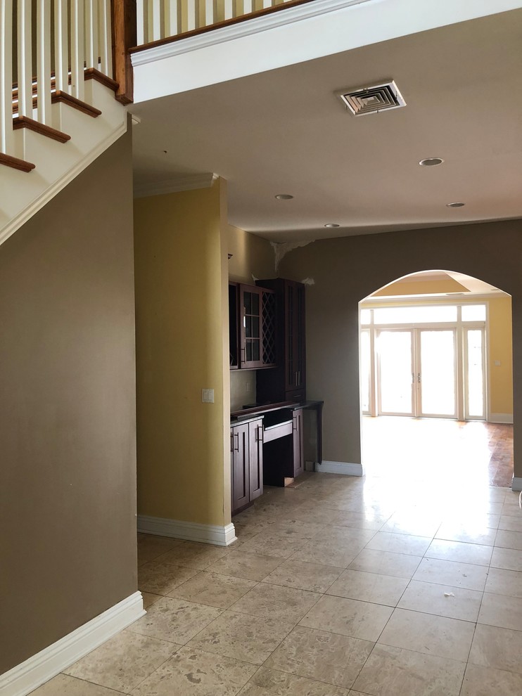 Refinish or Replace Travertine with Hardwood Flooring