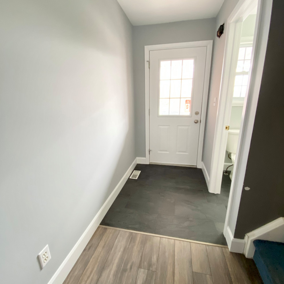 Transitional foyer photo with gray walls