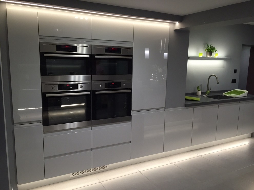 Inspiration for a mid-sized contemporary kitchen in Other with solid surface benchtops.