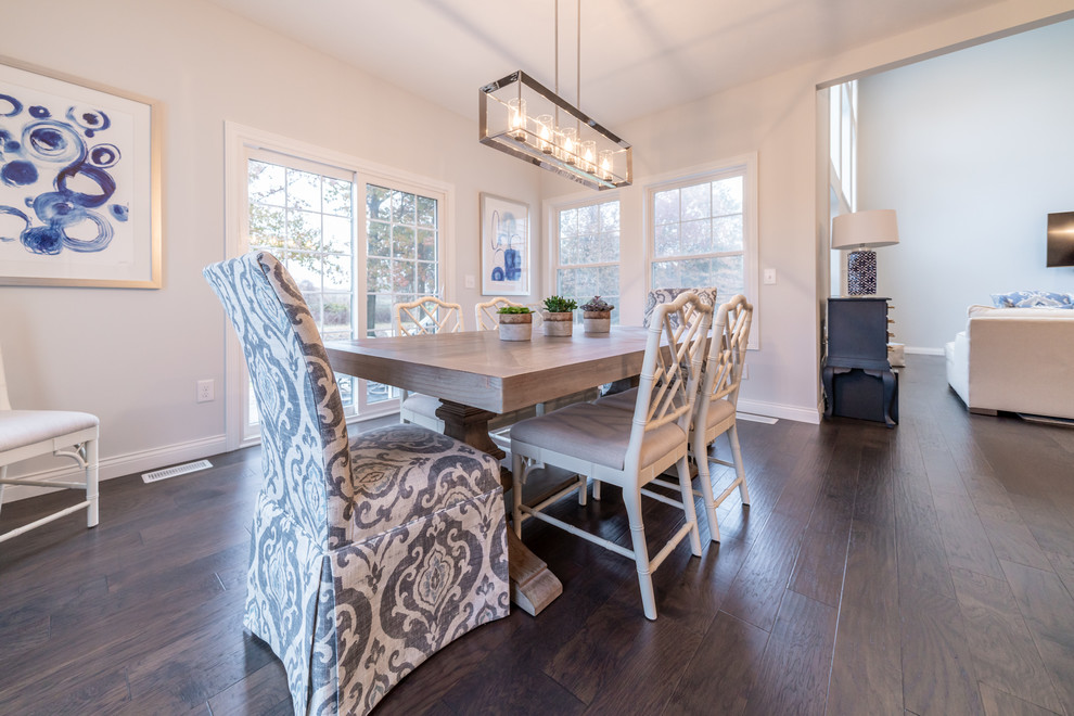 Inspiration for a transitional dark wood floor and brown floor great room remodel in Cleveland with gray walls