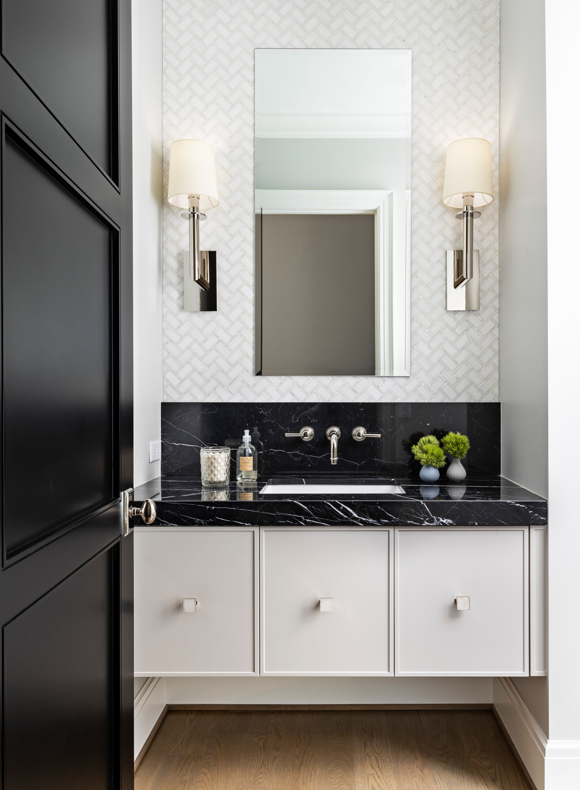 Parisian Powder Room- dramatic lines in black and white create a welcome viewpoint for this powder room entry.