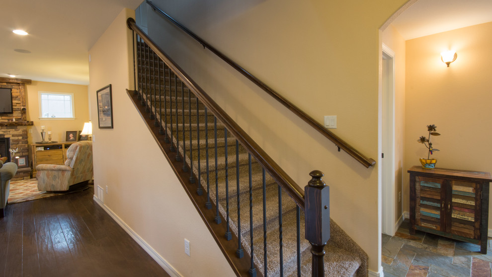 Inspiration for a traditional carpeted straight staircase in Denver with wood risers.