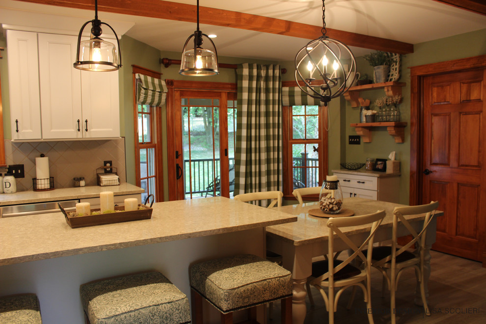 Inspiration for a mid-sized rustic l-shaped ceramic tile and beige floor eat-in kitchen remodel with a double-bowl sink, shaker cabinets, white cabinets, quartz countertops, beige backsplash, ceramic backsplash, stainless steel appliances, an island and beige countertops