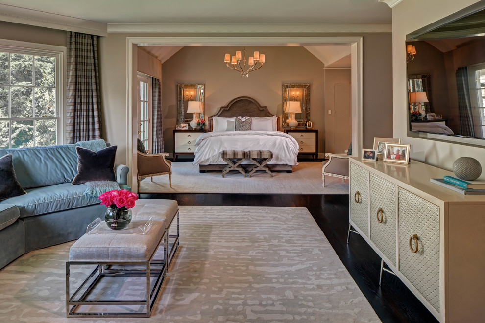 Photo of an expansive traditional master bedroom in Houston with grey walls, dark hardwood floors and brown floor.
