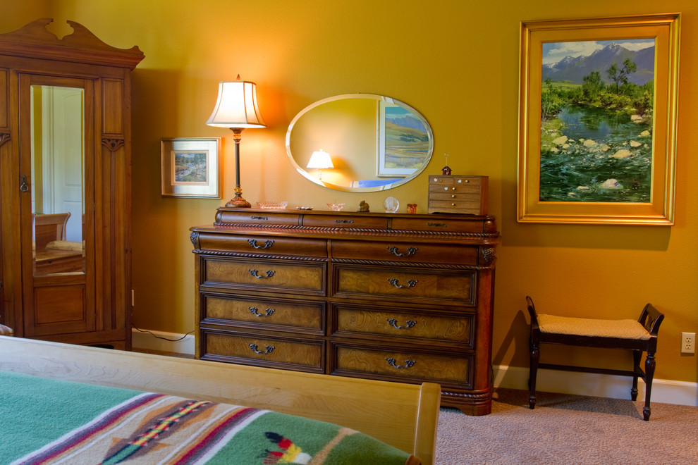This is an example of a large eclectic master bedroom in Portland with multi-coloured walls and carpet.