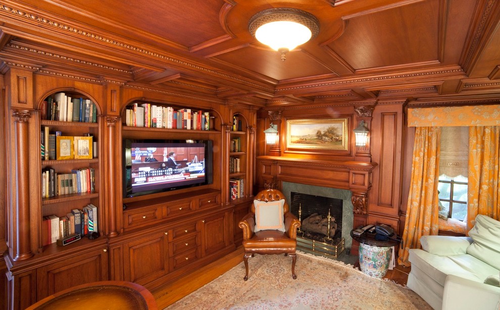 Photo of a mid-sized traditional study room in Bridgeport with brown walls, light hardwood floors, a standard fireplace, a stone fireplace surround and a freestanding desk.