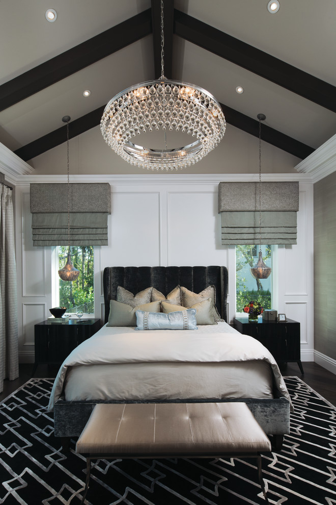 Design ideas for a traditional bedroom in Miami with white walls, dark hardwood floors and brown floor.