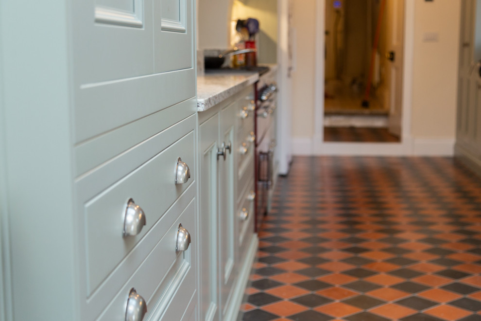 Design ideas for a mid-sized traditional galley kitchen in West Midlands.