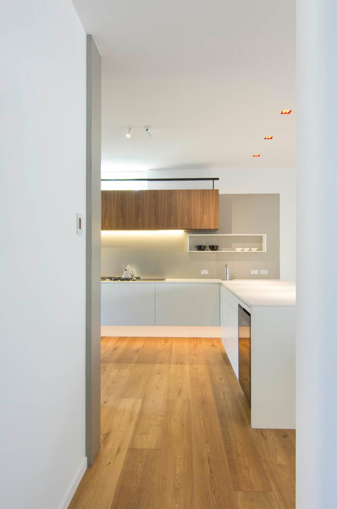 Inspiration for a large scandinavian l-shaped open plan kitchen in Sydney with quartz benchtops.