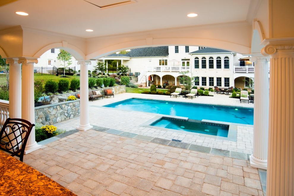 Design ideas for a large traditional backyard rectangular natural pool in DC Metro with a pool house.