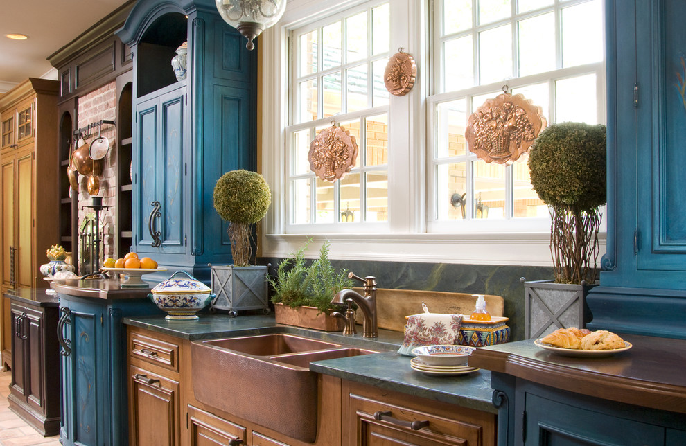Design ideas for a country kitchen in Indianapolis with a farmhouse sink, blue cabinets and granite benchtops.