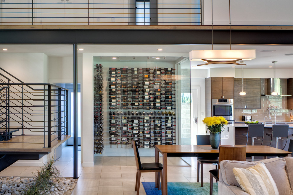Inspiration for a mid-sized modern wine cellar in Seattle with porcelain floors, display racks and white floor.