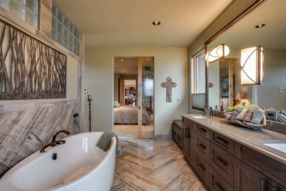 Transitional master bathroom in Seattle with an undermount sink, recessed-panel cabinets, dark wood cabinets, a freestanding tub and green walls.
