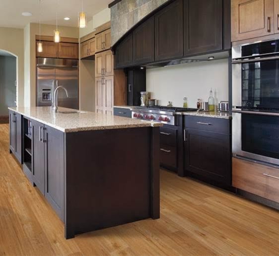Example of a large transitional l-shaped light wood floor and beige floor kitchen pantry design in Atlanta with an undermount sink, shaker cabinets, light wood cabinets, granite countertops, white backsplash, stainless steel appliances and an island