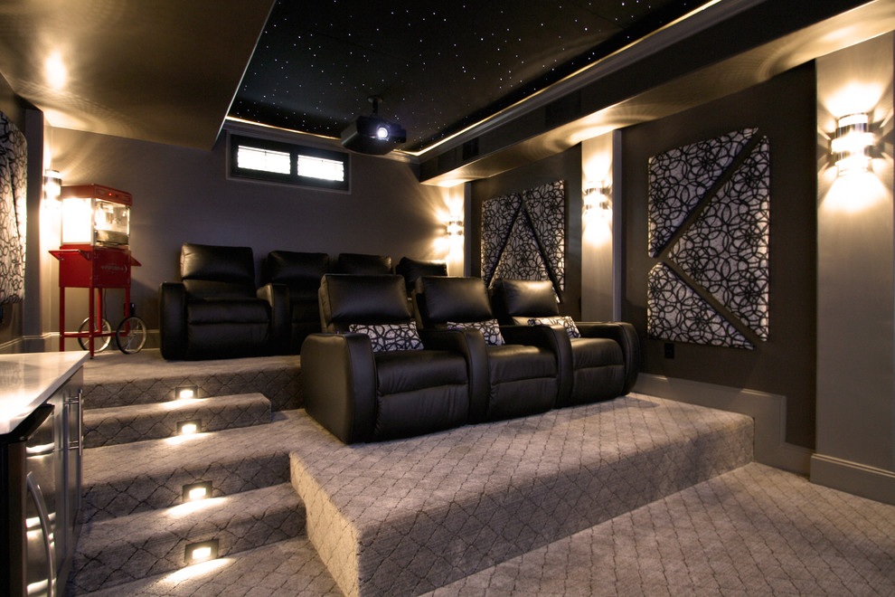 Photo of a mid-sized transitional enclosed home theatre in Atlanta with beige walls, carpet, a projector screen and beige floor.