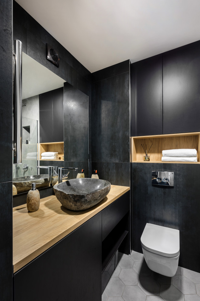 Contemporary bathroom in Saint Petersburg with flat-panel cabinets, black cabinets, a vessel sink, wood benchtops, grey floor and beige benchtops.