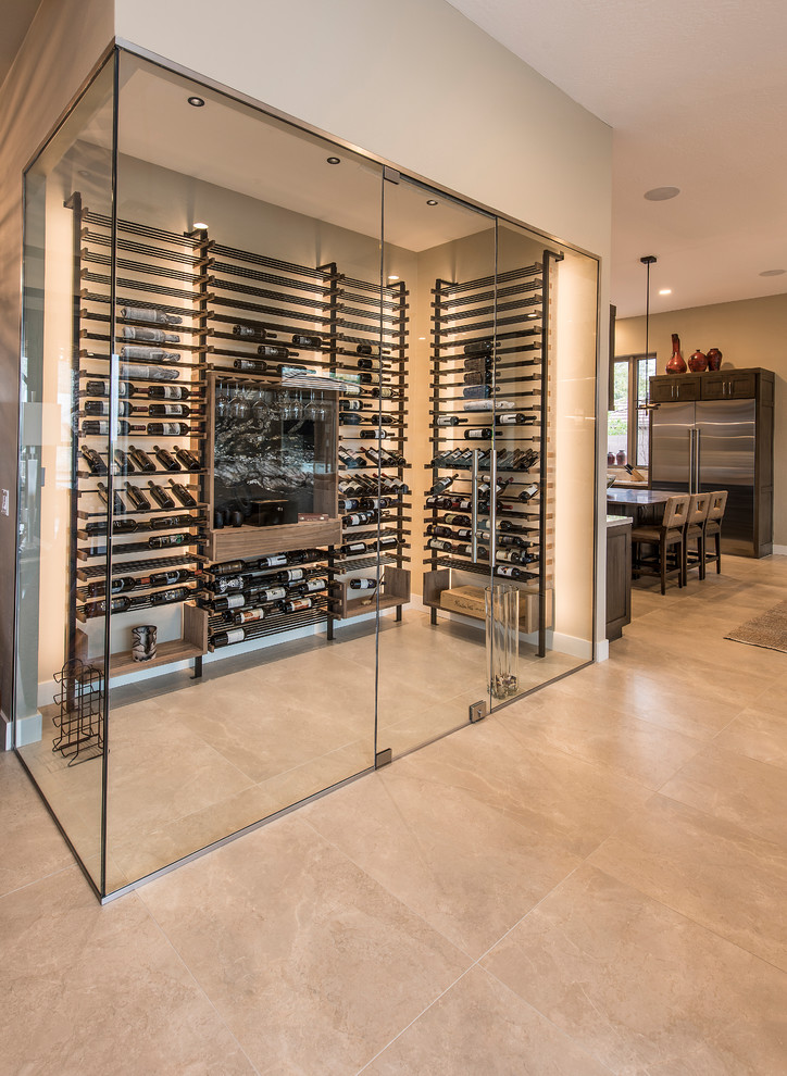 Inspiration for a large contemporary wine cellar in Phoenix with display racks, beige floor and porcelain floors.