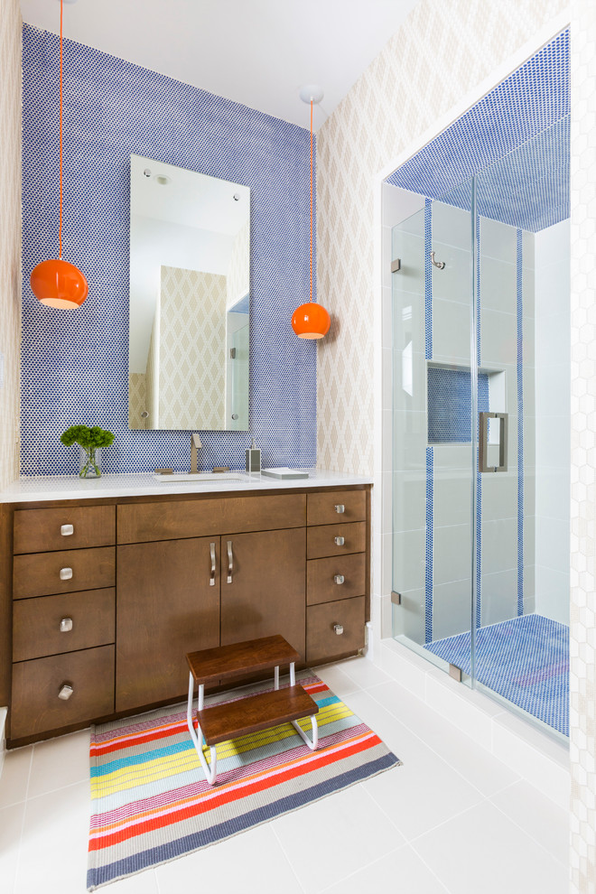 Inspiration for a contemporary bathroom in Houston with flat-panel cabinets, dark wood cabinets, an alcove shower, blue tile, white tile, multi-coloured walls, an undermount sink and a hinged shower door.
