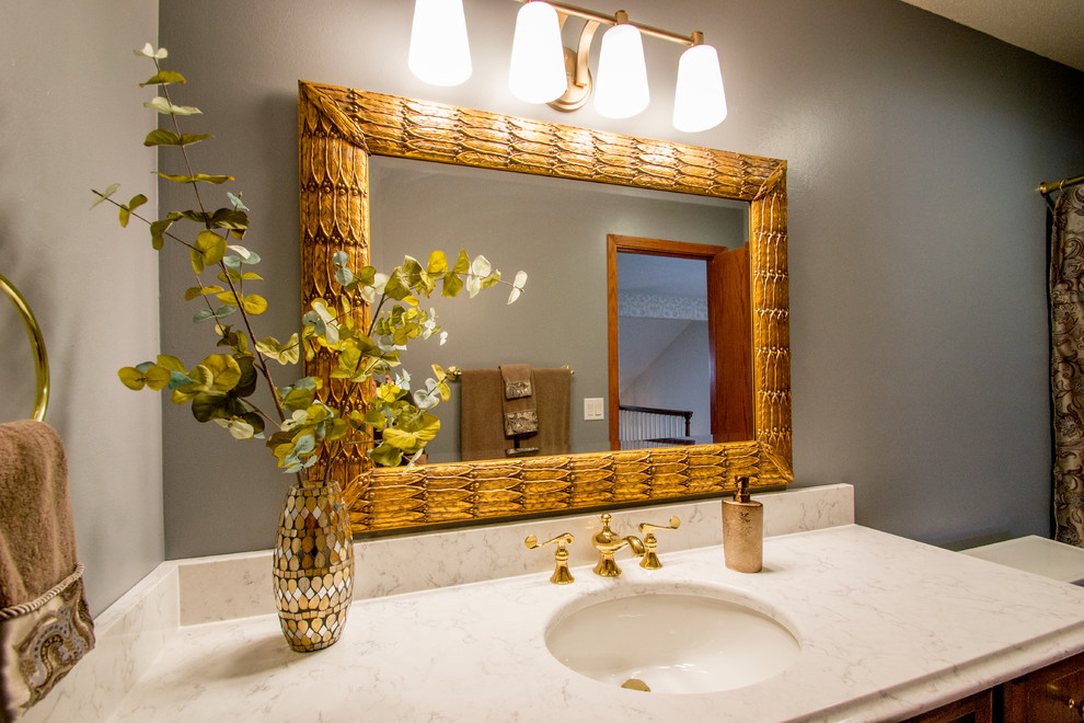 Inspiration for a mid-sized transitional single-sink bathroom remodel in Cedar Rapids with granite countertops, white countertops, gray walls and a drop-in sink