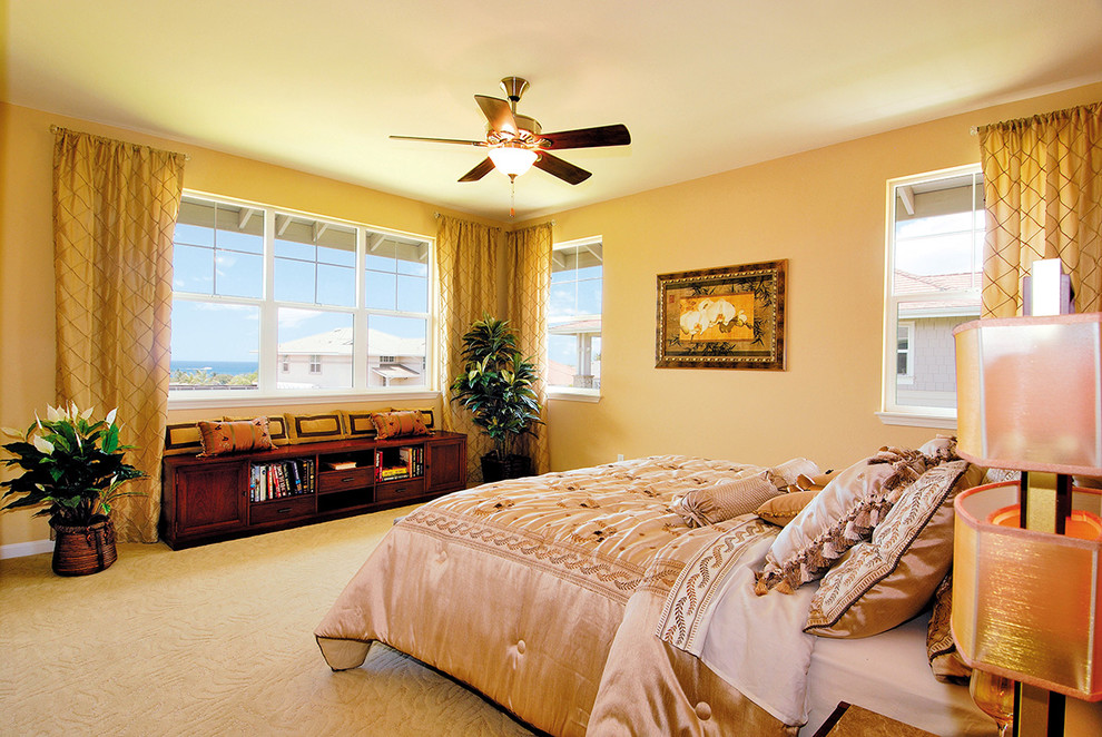 Mid-sized contemporary master bedroom in Hawaii with beige walls and carpet.