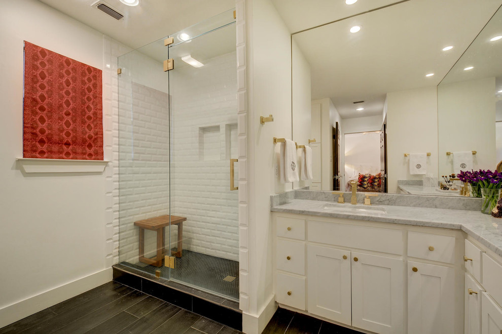 Transitional white tile alcove shower photo in Austin with white cabinets, white walls and a drop-in sink