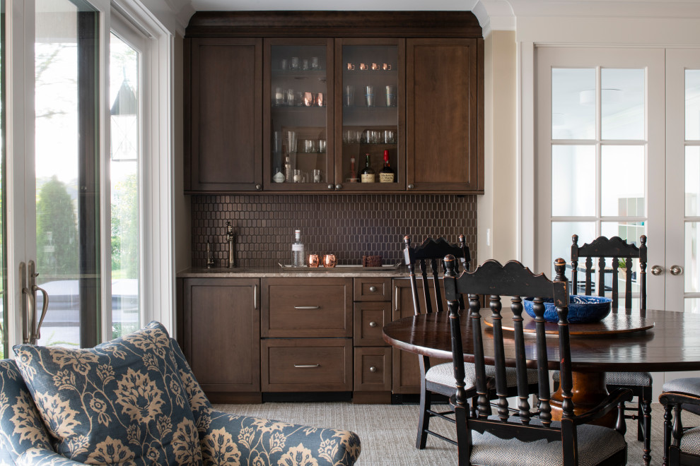 Photo of a small beach style single-wall wet bar in Minneapolis with an undermount sink, recessed-panel cabinets, dark wood cabinets, brown splashback, ceramic splashback, carpet, multi-coloured floor and multi-coloured benchtop.