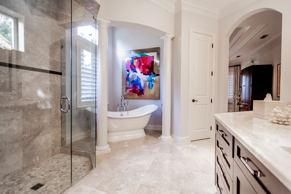 Photo of a mid-sized contemporary master bathroom in Jacksonville with raised-panel cabinets, dark wood cabinets, a freestanding tub, an open shower, multi-coloured tile, porcelain tile, an undermount sink, granite benchtops, white walls and beige floor.