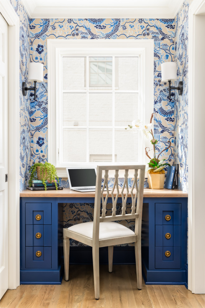 Example of a built-in desk wallpaper home office design in Atlanta with multicolored walls