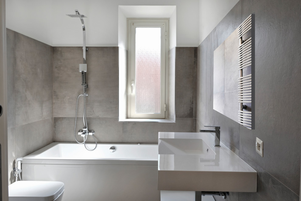 Mid-sized master bathroom in Rome with open cabinets, white cabinets, a freestanding tub, a shower/bathtub combo, a two-piece toilet, gray tile, porcelain tile, white walls, dark hardwood floors, an integrated sink, onyx benchtops, beige floor, an open shower and white benchtops.