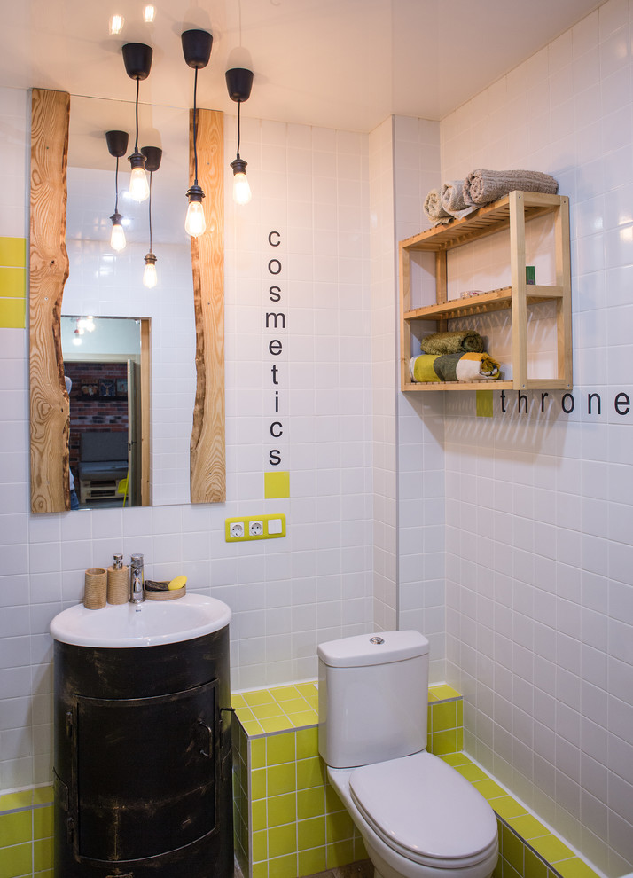 Photo of an eclectic bathroom in Other with a two-piece toilet, white tile and yellow tile.