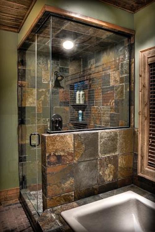 Inspiration for a country bathroom in Minneapolis with a corner shower, brown walls and a hinged shower door.