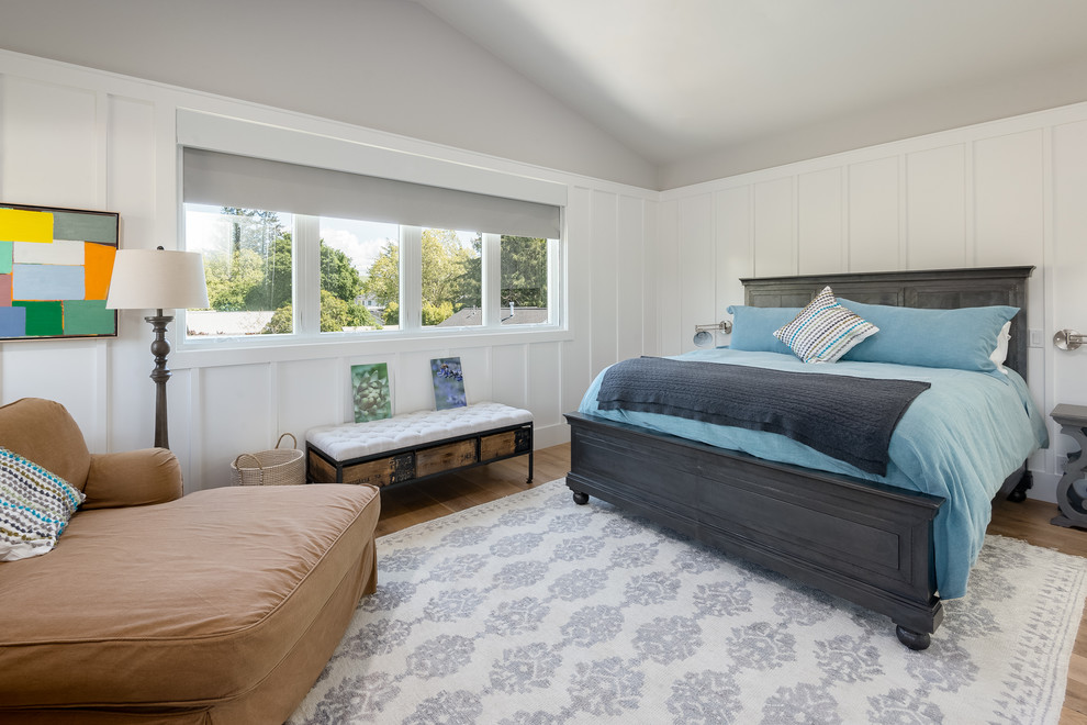 This is an example of a country bedroom in San Francisco with grey walls, medium hardwood floors and brown floor.