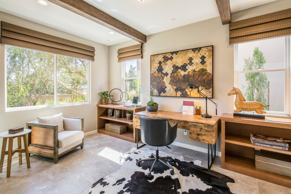 Inspiration for a large modern home office in Phoenix with beige walls and porcelain floors.