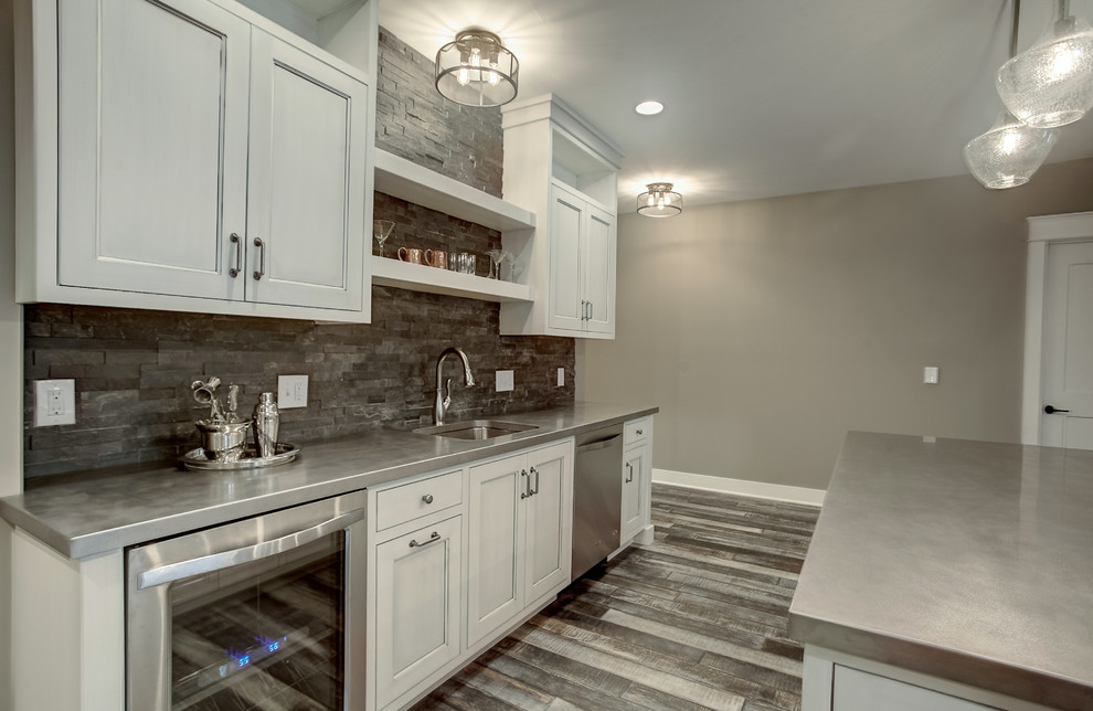 Inspiration for a transitional basement remodel in Grand Rapids with beige walls