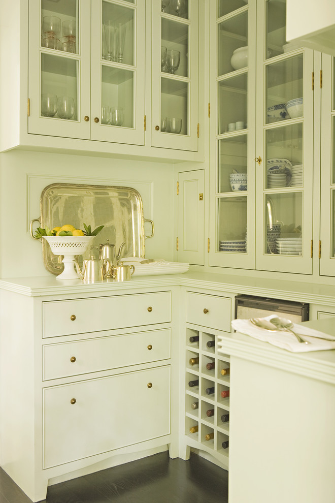 Design ideas for a transitional kitchen pantry in Los Angeles with glass-front cabinets and white cabinets.