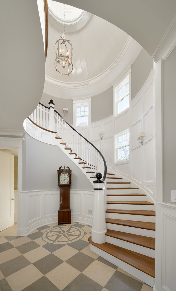 This is an example of a traditional entryway in Chicago with limestone floors.