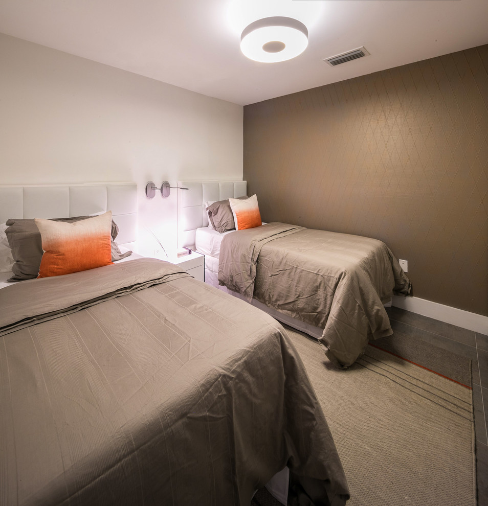 This is an example of a modern guest bedroom in Miami with brown walls and carpet.