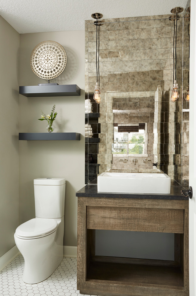 Photo of a small transitional powder room in Minneapolis with grey walls, ceramic floors, marble benchtops, dark wood cabinets, a two-piece toilet, mirror tile, a vessel sink, open cabinets, white tile, beige tile, black tile and white floor.
