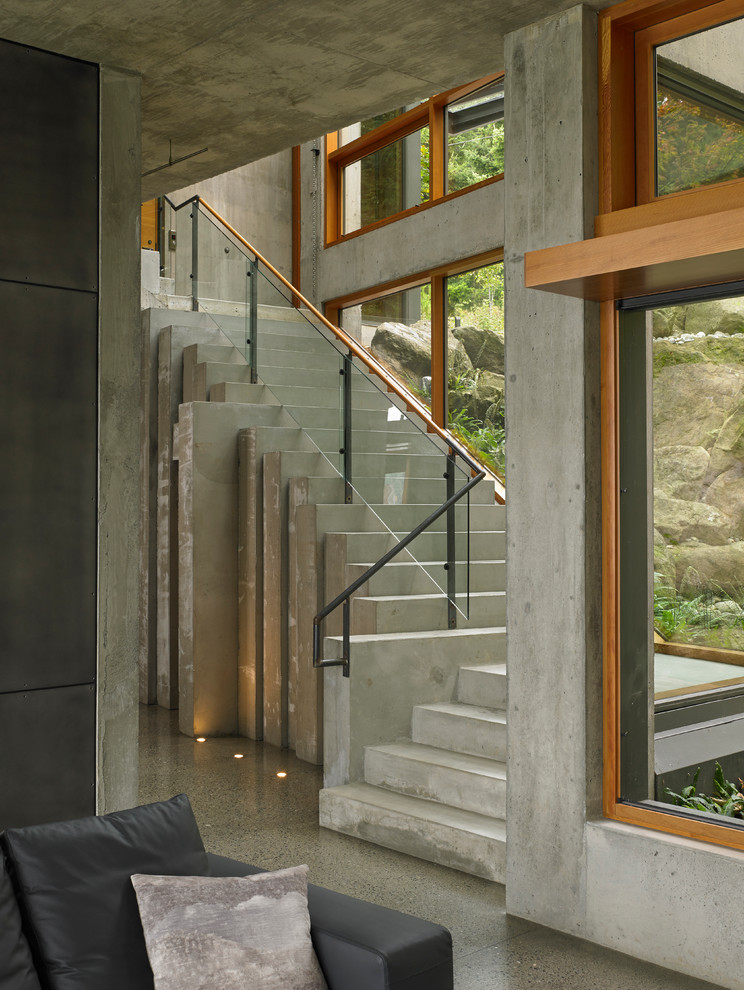 Inspiration for a contemporary staircase in Seattle with glass railing.