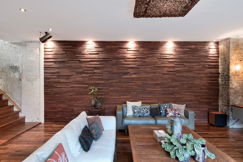Mid-sized eclectic formal enclosed living room in Sydney with medium hardwood floors, no fireplace and no tv.